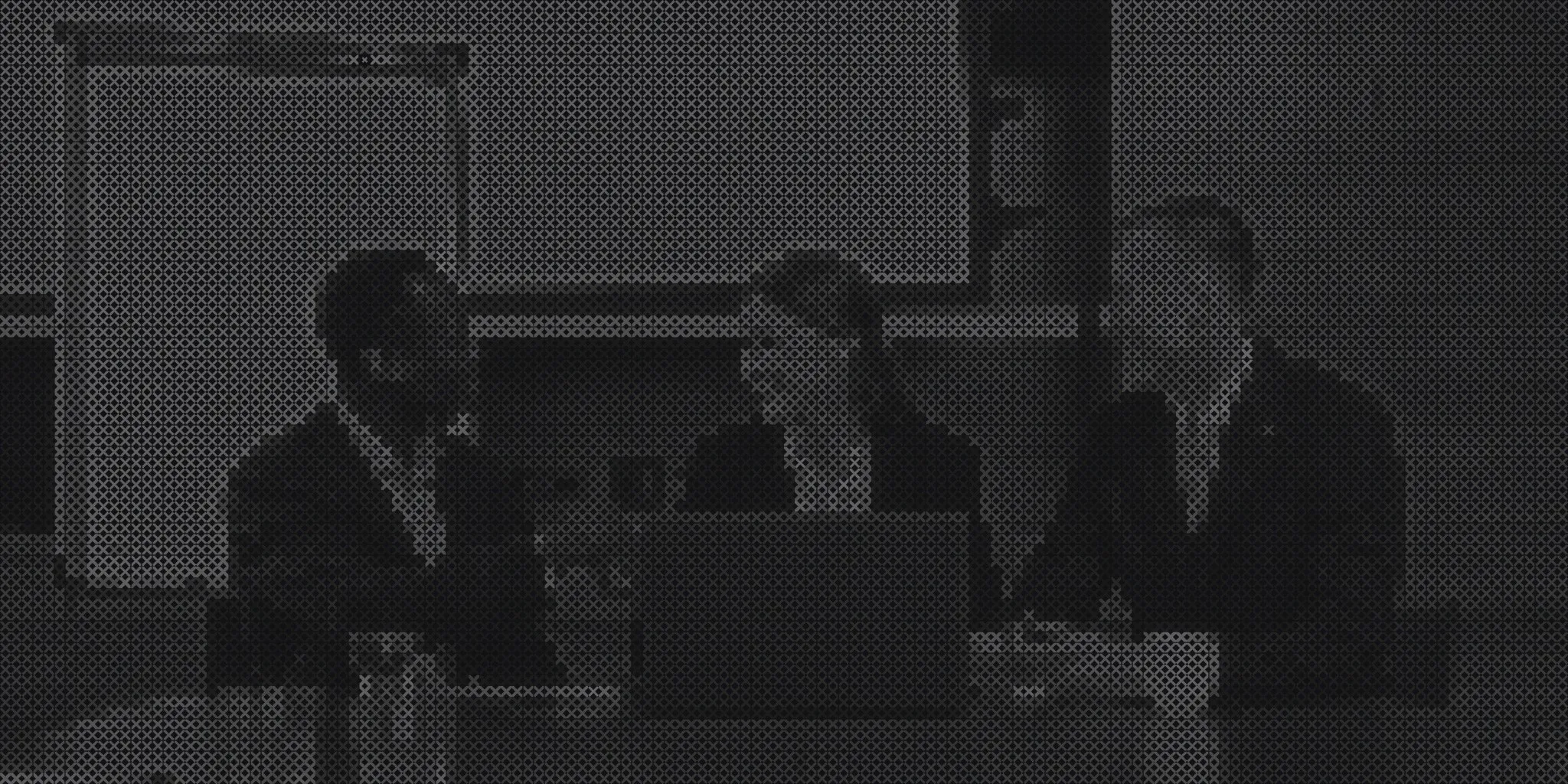 Two employees reviewing documents in an office